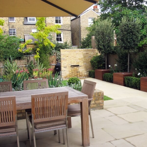 In-the-middle-of-blooming-lavender-a-tiny-townhouse-garden-with-patio-furniture-garden-design-south-west-London.